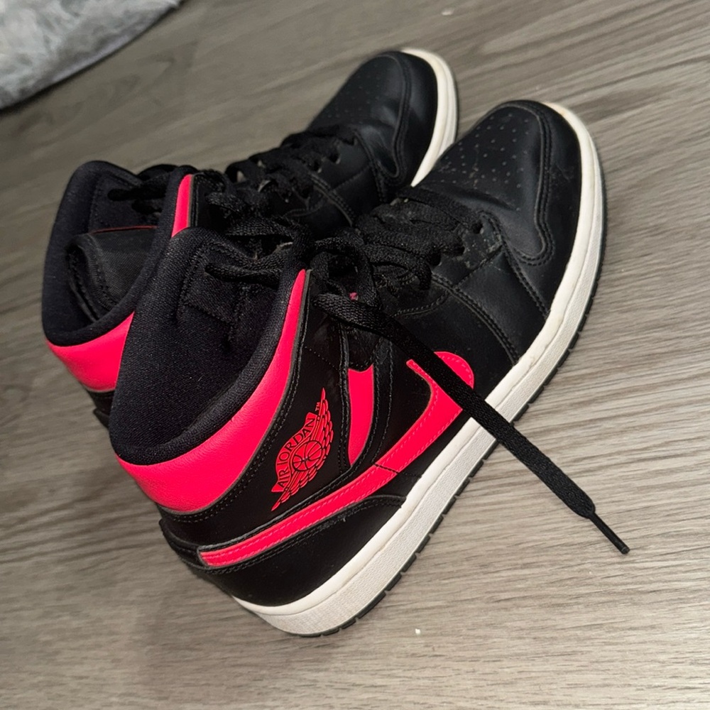 Black and pink Jordan 1s